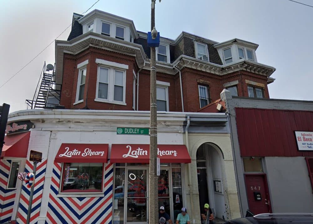 Corner view showing the upper floors and fire escape